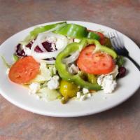 Greek Salad · Topped with feta cheese, Greek olives, pepperoncinis, beets, tomatoes and onions. Served wit...