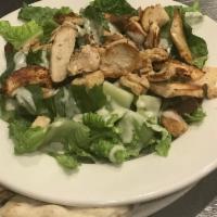 Caesar Salad with Grilled Chicken · Romaine lettuce, Parmesan cheese and croutons tossed in Caesar dressing.