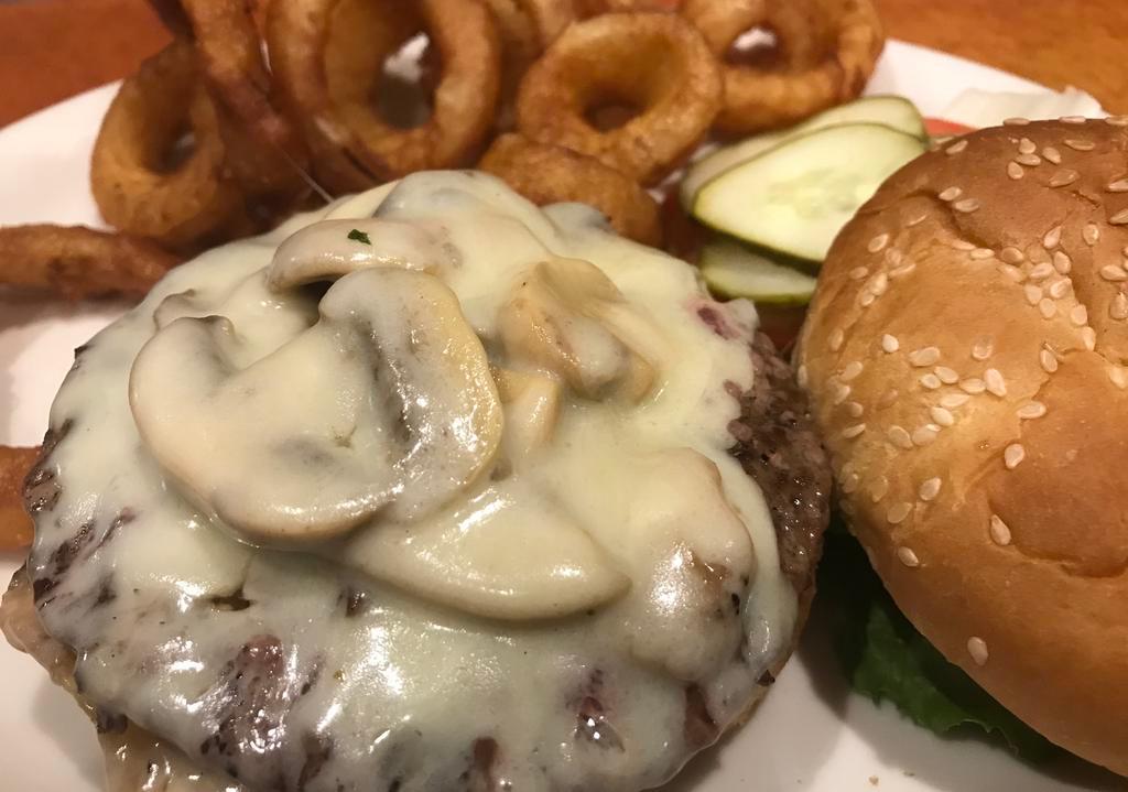 Mushroom Swiss Burger with Fries · Topped with sauteed mushrooms and Swiss cheese. Served with lettuce, tomato and pickle. 1/3 lb. 100% pure ground beef.