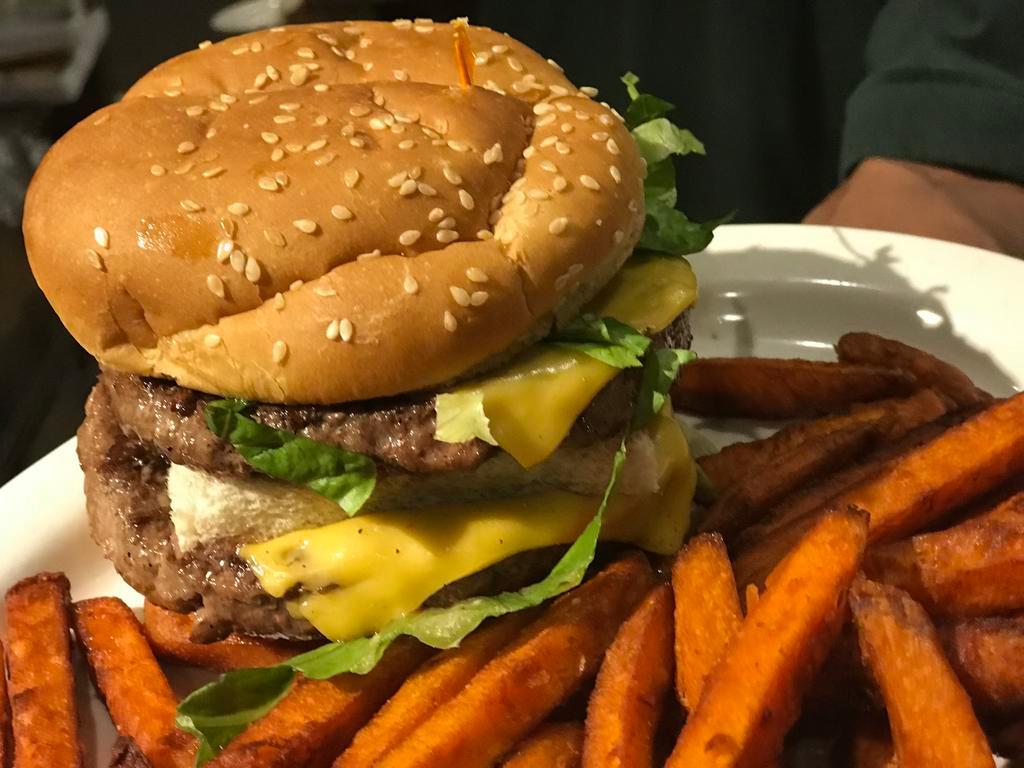 The Famous Imitator Burger with Fries · Double Decker. 2 big patties grilled with cheese on a toasted, buttered sesame seed bun with shredded lettuce, tomato and special sauce. 1/3 lb. 100% pure ground beef.
