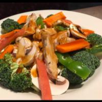 Chicken Breast Stir-Fry · Chicken breast, fresh broccoli, zucchini, onions, peppers, carrots and mushrooms sauteed wit...