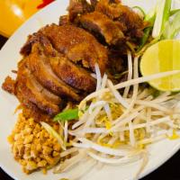 Pad Thai Duck · Fried crispy duck with rice noodles, egg, bean sprouts, green onions and crushed peanuts in ...