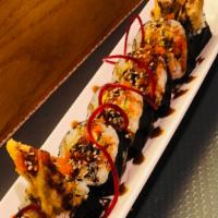 Spider Roll · Soft shell crab, avocado, cucumber and masago topped with eel sauce.