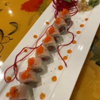 Atlantic Roll · Tuna, salmon and white tuna topped with yellowtail  and masako.