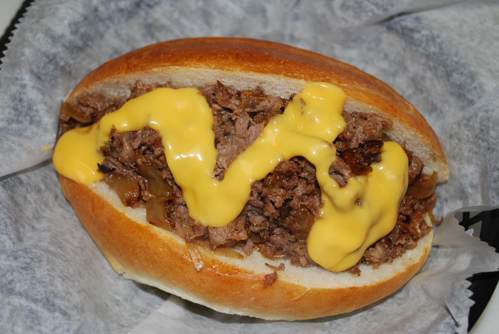 Philly Cheese Steak · Sliced Angus beef, cheddar cheese, and sauteed onions on a club roll.

