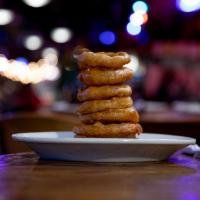 Beer Battered Onion Rings · After a long day, nothing goes better with a frosty mug of beer than a heaping pile of our s...