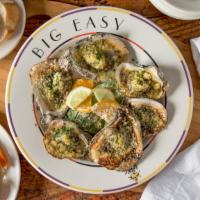 Charbroiled Oysters · Fresh gulf oysters charbroiled with herbed garlic butter, Parmesan and Romano cheeses.