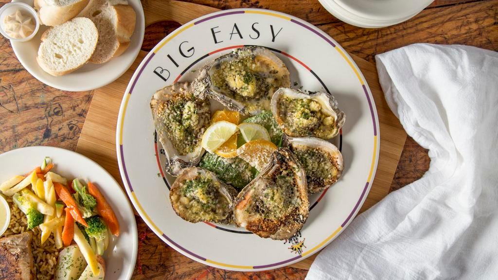 Charbroiled Oysters · Fresh gulf oysters charbroiled with herbed garlic butter, Parmesan and Romano cheeses.