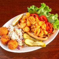 Shrimp Po’boy · Tender shrimp tossed in our signature Cajun seasoned batter, fried ’til golden and piled on ...