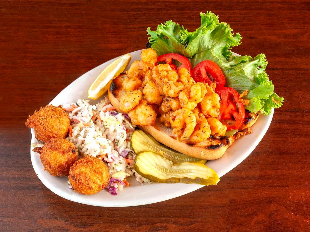Shrimp Po’boy · Tender shrimp tossed in our signature Cajun seasoned batter, fried ’til golden and piled on a baguette.