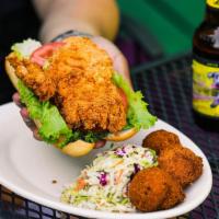 Chicken Po’boy · Can be served blackened or grilled. Tender chicken breast fried golden brown and served on a...