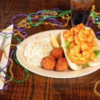 Crawfish Po’boy · Crawfish tails tossed in our signature Cajun seasoned batter, fried ’til golden and piled on...