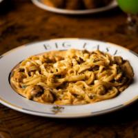 Chicken Fettuccine · Diced chicken tenders sauteed and finished with fettuccine and Parmesan cream sauce.