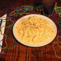 Shrimp Fettuccine · Plump, juicy shrimp sautéed in a made from scratch Parmesan cream sauce and tossed with fett...