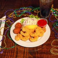 Cajun Fried Shrimp · Tail on medium sized shrimp battered in seasoned yellow 
cornmeal and fried golden brown.