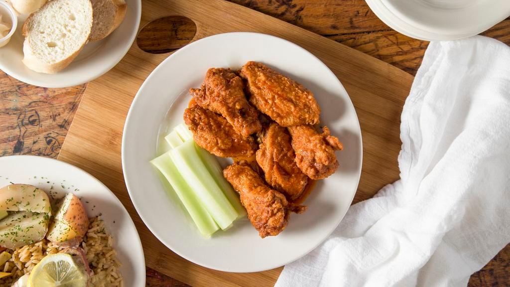 Voodoo Chicken Strips · Seasoned and battered chickens strips tossed in our made 
from scratch Voodoo Sauce, and served with your choice of 
ranch or bleu cheese dressing.