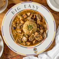 Blackened Chicken and Mushroom Etouffee · Diced blackened chicken tenders sauteed with mushrooms in our spicy dark roux and stock sauc...
