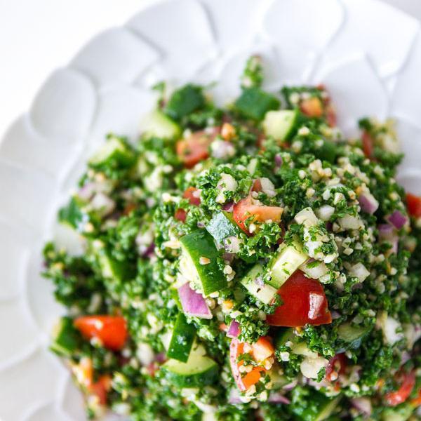 Tabouleh · Chopped parsley, bulgar (crushed wheat), tomatoes, onions, spices, olive oil and lemon juice. Vegetarian.