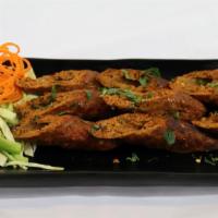 Sheekh Kabab · Skewered juicy rolls of minced lamb blended with fresh cilantro, ginger, garlic, and spices ...