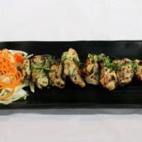 Malai Chicken Tikka · Boneless cubes of chicken marinated in a paste of garlic, cream cheese, herbs and spices.