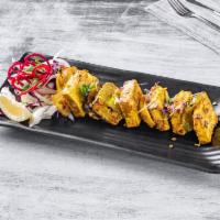 Paneer Tikka · Cottage cheese marinated in yogurt, spices and grilled with peppers and onions.