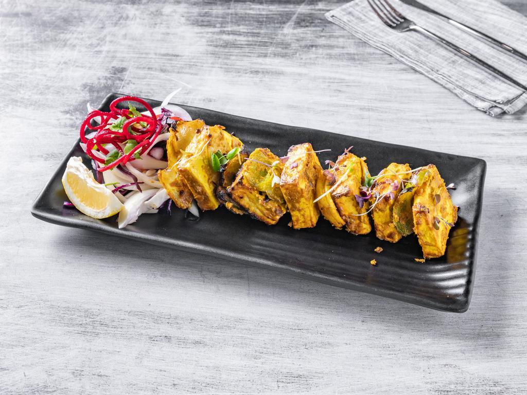 Paneer Tikka · Cottage cheese marinated in yogurt, spices and grilled with peppers and onions.