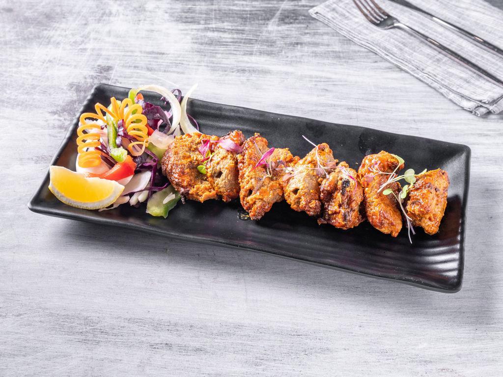 Bhara Kabab · Tender pieces of boneless lamb marinated in spices and herbs.