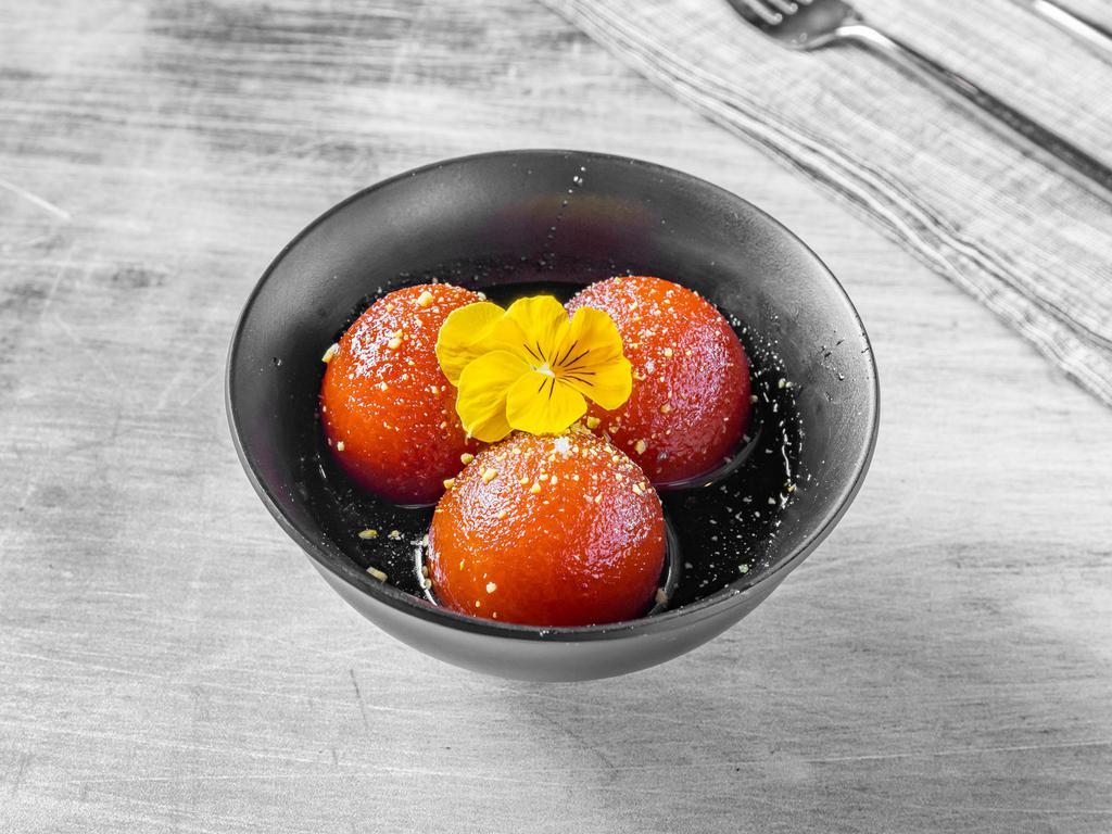 Gulab Jamun · Spongy milk balls soaked in a rose scented sugar syrup. 