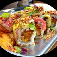 Tataki Roll · Shrimp tempura and spicy tuna roll topped with seared black pepper tuna, crispy onion, and s...