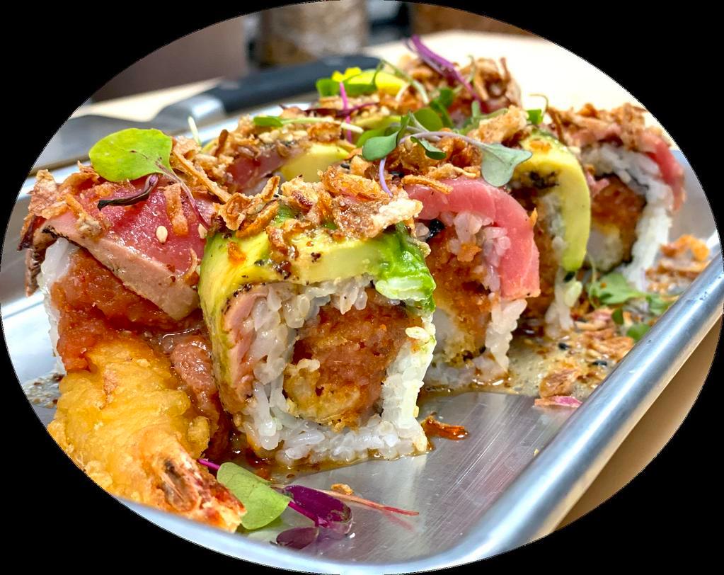 Tataki Roll · Shrimp tempura and spicy tuna roll topped with seared black pepper tuna, crispy onion, and spicy house vinaigrette.