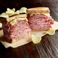 The New York Yankee · 3/4 lb. combo of hot corned beef and pastrami, Swiss and toasted rye.