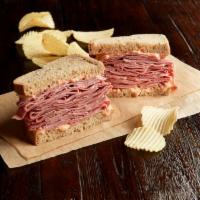 Hot Corned Beef Sandwich · 1/2 lb. of hot corned beef. Your choice of bread topped the way you like it.