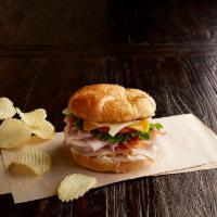Club Royale Sandwich · Nitrite-free smoked turkey breast and ham, bacon, Swiss, cheddar, leafy lettuce, tomato, hon...
