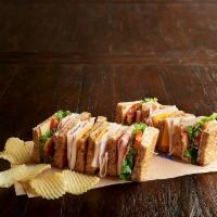 Deli Club Sandwich · Nitrite-free ham, roasted turkey breast, bacon, cheddar, Swiss, leafy lettuce, tomato, mayo ...