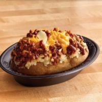 Texas Style Spud · Chopped pit-smoked beef brisket, barbecue sauce, cheddar, butter on a baked potato. Gluten s...