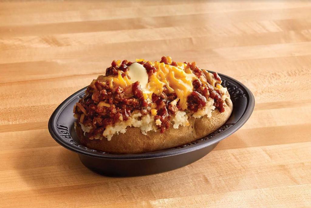 Texas Style Spud · Chopped pit-smoked beef brisket, barbecue sauce, cheddar, butter on a baked potato.