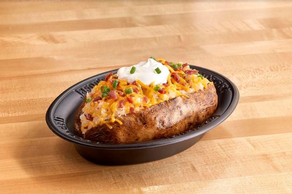 The Plain Jane Potato · Cheddar, sour cream, butter, bacon, green onion on a baked potato. Gluten sensitive.