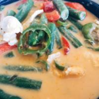 Panang Curry · String bean, red bell pepper, long hot chili and lime leaves with coconut milk. Medium spicy.