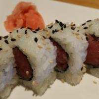 83. Tuna Roll · 8 pieces of fresh red tuna and seed with seaweed sheet and rice on the outside.