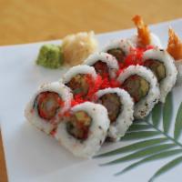 85. Chiangmai Roll · 10 pieces of fried shrimp, avocado and seed with seaweed sheet and rice on the outside.