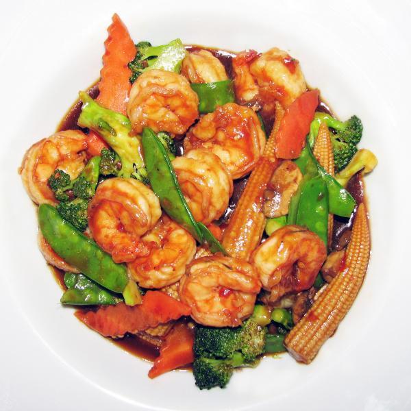 44. Szechuan Shrimp · Jumbo shrimp with mushrooms, broccoli, scallion, snow peas, zucchini, and carrots in a spicy Szechuan sauce. With a side of rice. Spicy.