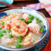 46. Shrimp with Lobster Sauce · Jumbo shrimp with peas and carrots in white lobster sauce. With a side of rice.