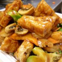 49. Bean Curd Home Style · Fried bean curd with broccoli, mushroom, snow peas, carrots, water chestnuts, and cabbage in...