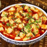 50. Ma Po Tofu · Bean curd with peas and carrots, with in spicy Szechuan sauce. With a side of rice. Spicy. 