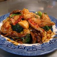 56. Happy Family · Jumbo shrimp, beef, chicken, pork, immitation crab, and scallop with mixed vegetable in brow...
