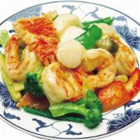 57. Seafood Delight · Jumbo shrimp, scallop, immitation crab, and squid with mixed vegetable in white seafood sauc...
