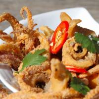 59. Salt and Pepper Squid · Crispy squid with salt and pepper, bell peppers, jalapeños, and onions. With a side of rice.