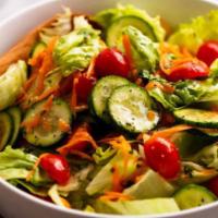 Garden Salad · Mixed Greens, cucumber and tomato.