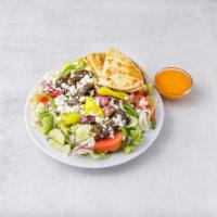 Greek Salad · Crisp greens with tomato, cucumber, onions, peppers, feta cheese, and olives tossed with oli...