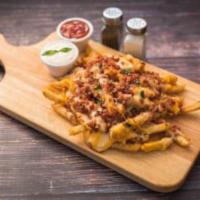 Mega Fries · Topped with cheddar cheese, mozzarella cheese and crispy bacon. Served with ranch dipping sa...